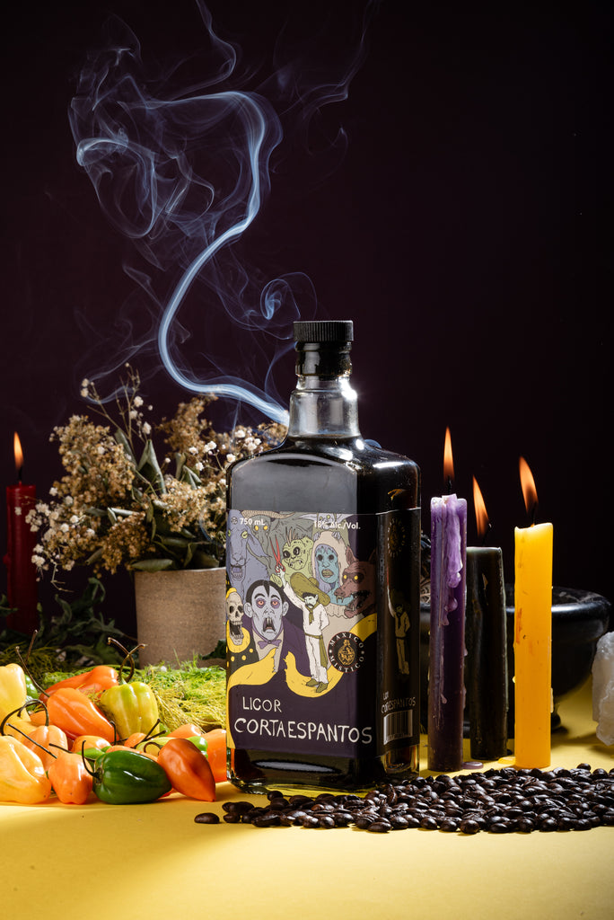 Bottle of Licor Corta esapantos with Habaneros, candles, and crystals on a yellow surface moodboard 2