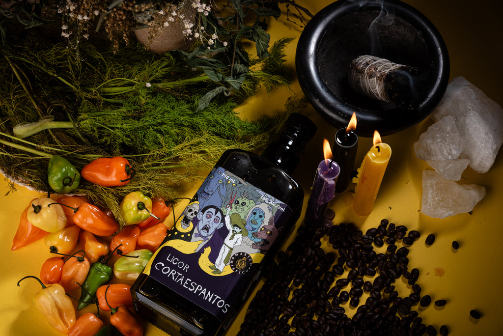 Bottle of Licor Corta esapantos with Habaneros, candles, and crystals on a yellow surface moodboard